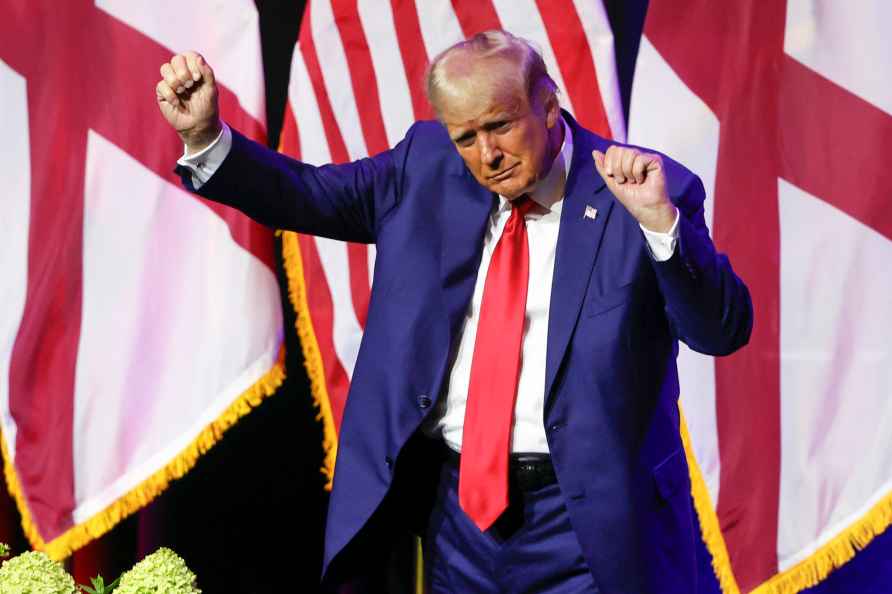 Former President Donald Trump dances as he leaves the stage after...