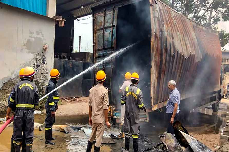 Ghaziabad: Fire brigade personnel douse the fire which broke out...