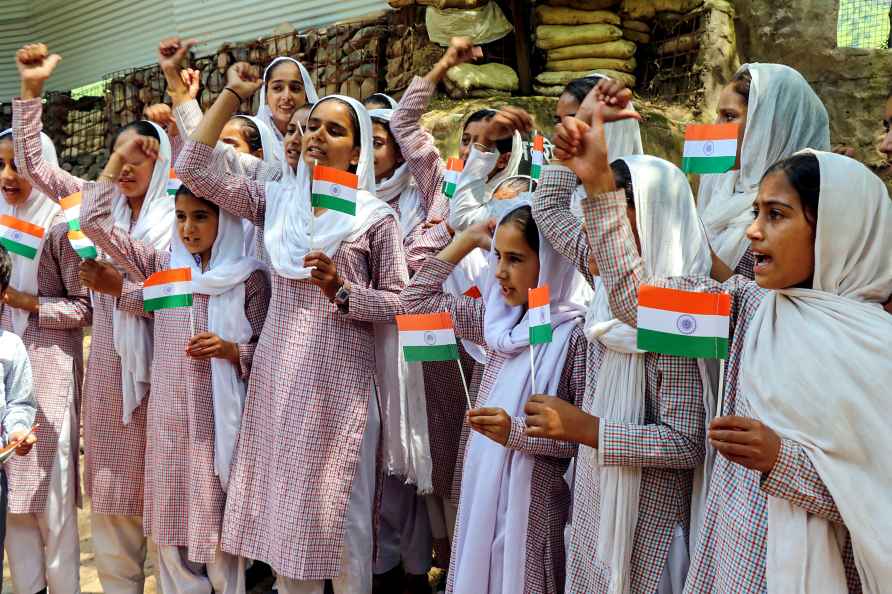 Poonch: School children carry miniature Indian national flags in...