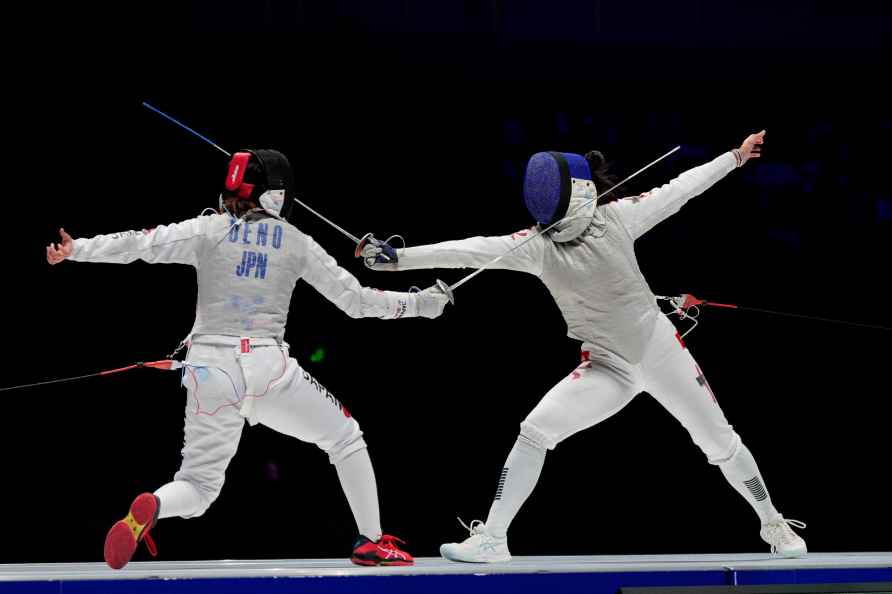 Hong Kong's Valeria Cheng, right, competes with Japan's Ueno Yuka...