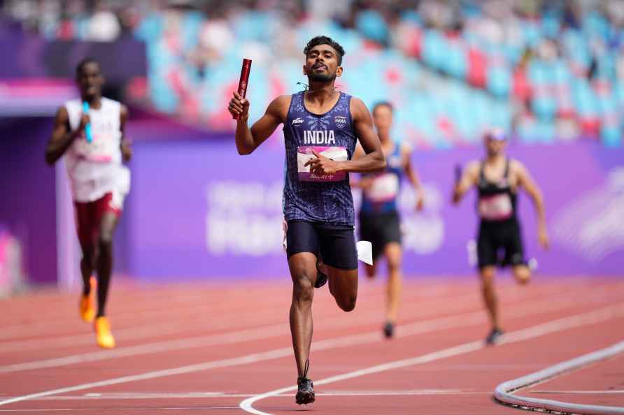 India's Mijo Chacko Kurian crosses the finish line during the men...