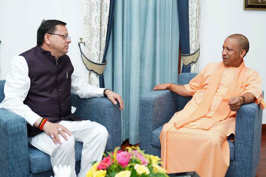 Yogi Adityanath meets Pushkar Singh Dhami