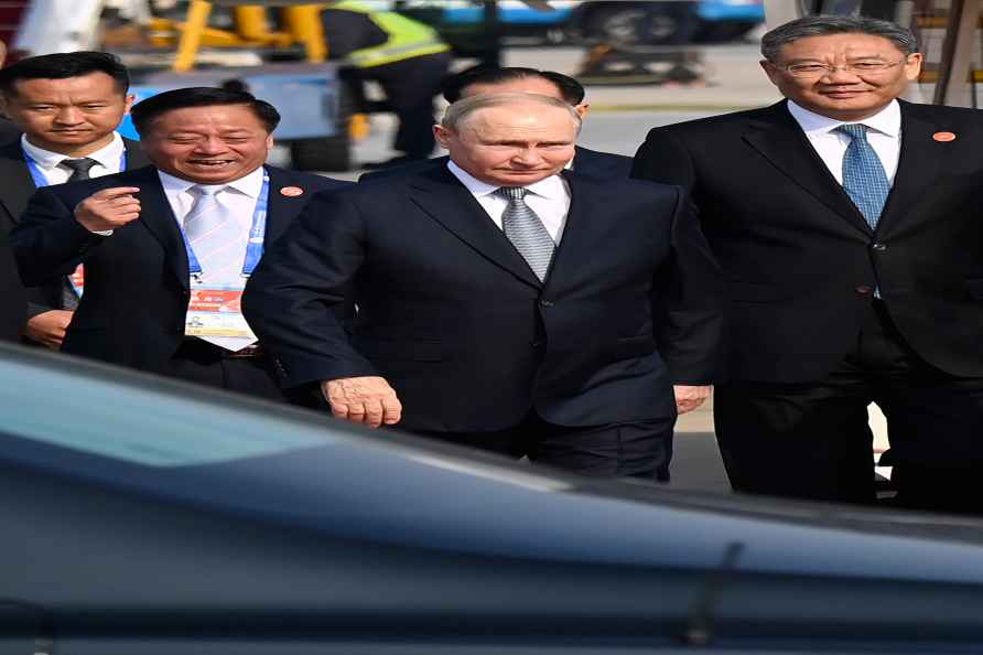 Russia's President Vladimir Putin, center, arrives at Beijing Capital...