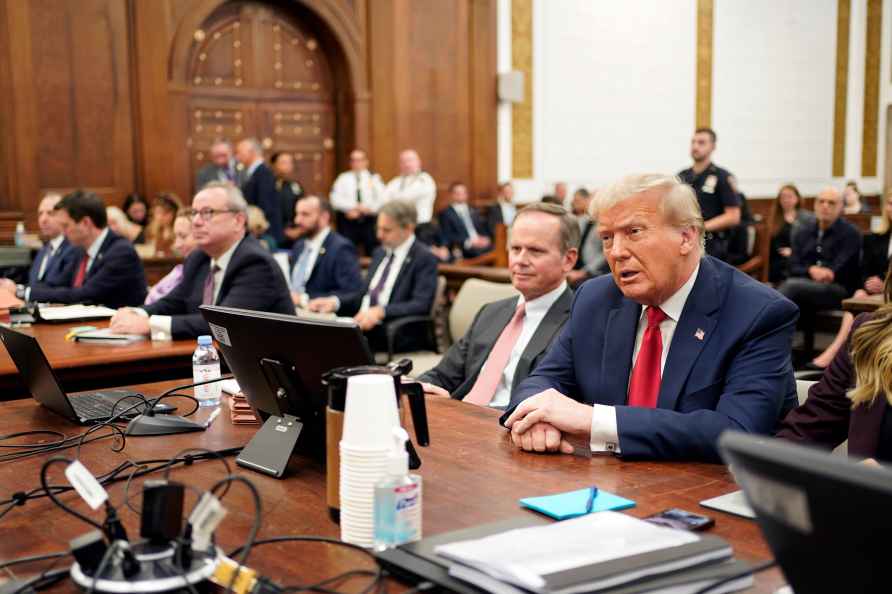 Former President Donald Trump sits in the courtroom with his legal...