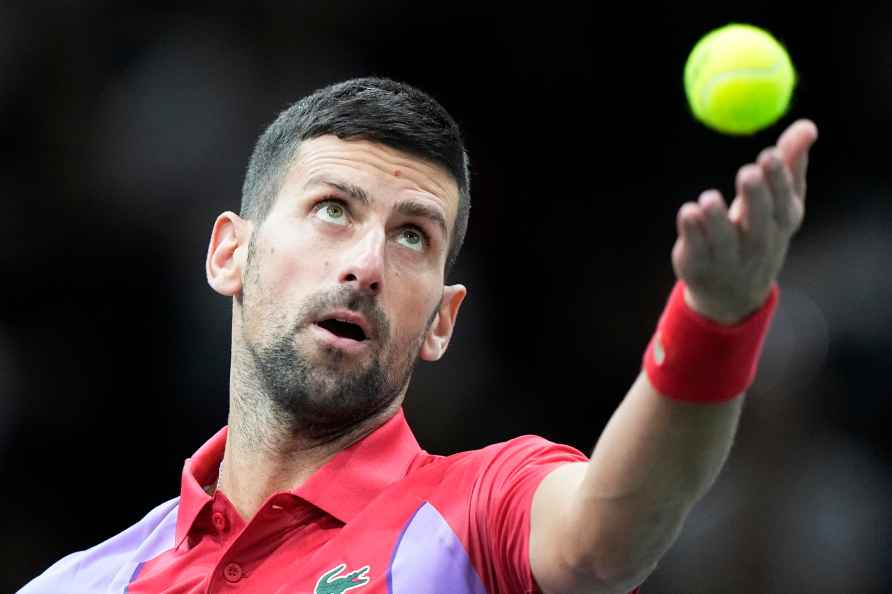 Serbia's Novak Djokovic serves to Argentina's Tomas Martin Etcheverry...