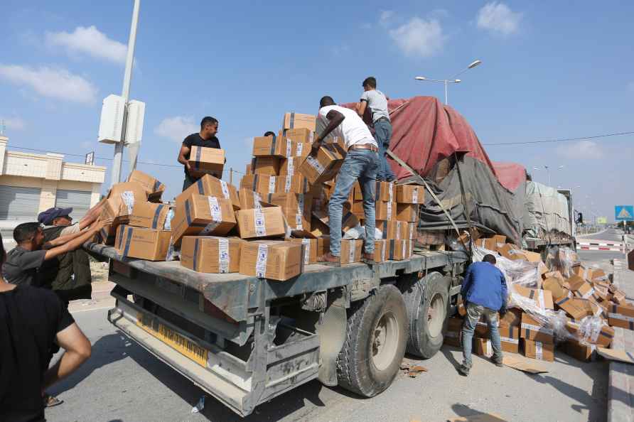 Palestinians loot a truck with humanitarian aid