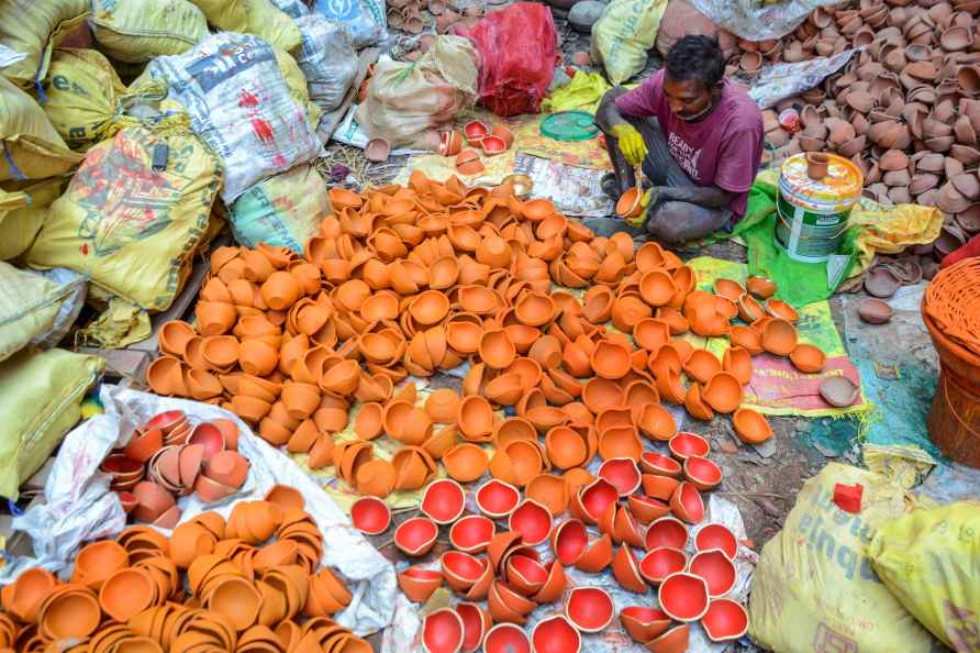 Amritsar: A craftsman paints 'diyas' ahead of the festival of Diwali...