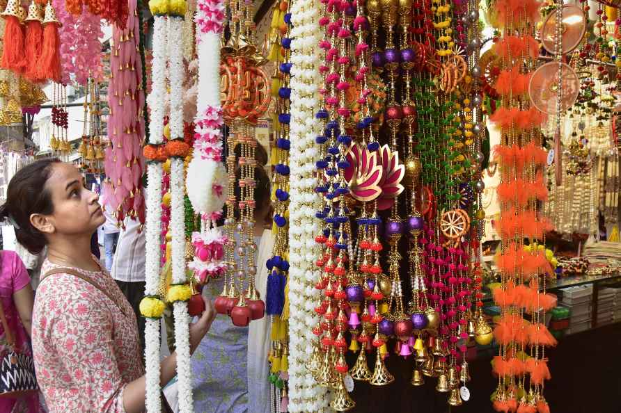 Guwahati: A woman buys decorative items ahead of Diwali festival...