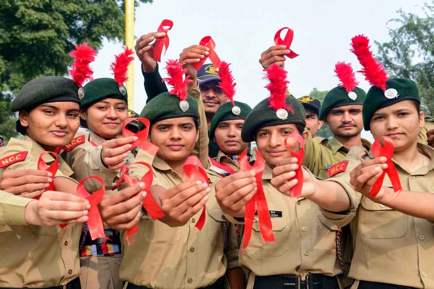 Bikaner: NCC cadets pose for photos during an AIDS awareness campaign...