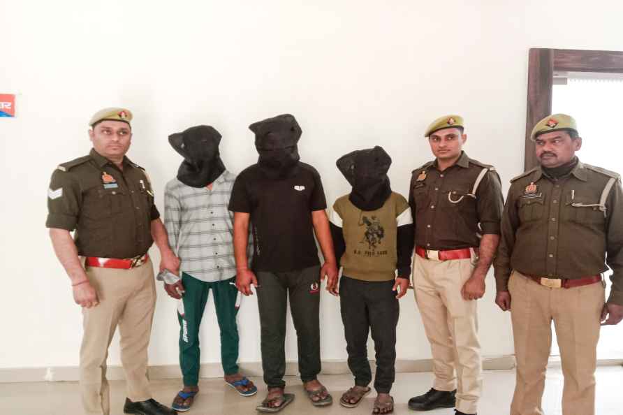 Ghaziabad: Police personnel with three men who were arrested on ...