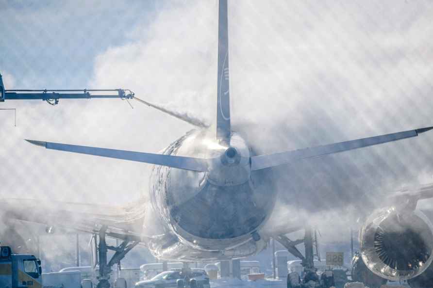 A passenger plane is cleared of ice in Munich Airport