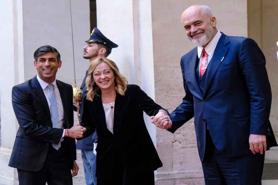 Italy's Prime Minister Giorgia Meloni, centre, welcomes Britain'...