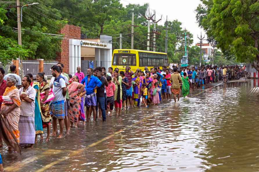 Thoothukudi: Residents of a flood-affected area wait in a queue ...