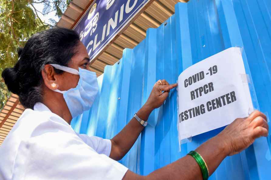 Chikkamagaluru: A medic puts up a notice at a Covid-19 testing centre...