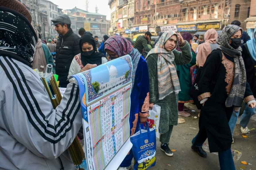 Srinagar: A vendor sells calendars for the year 2024 on the first...