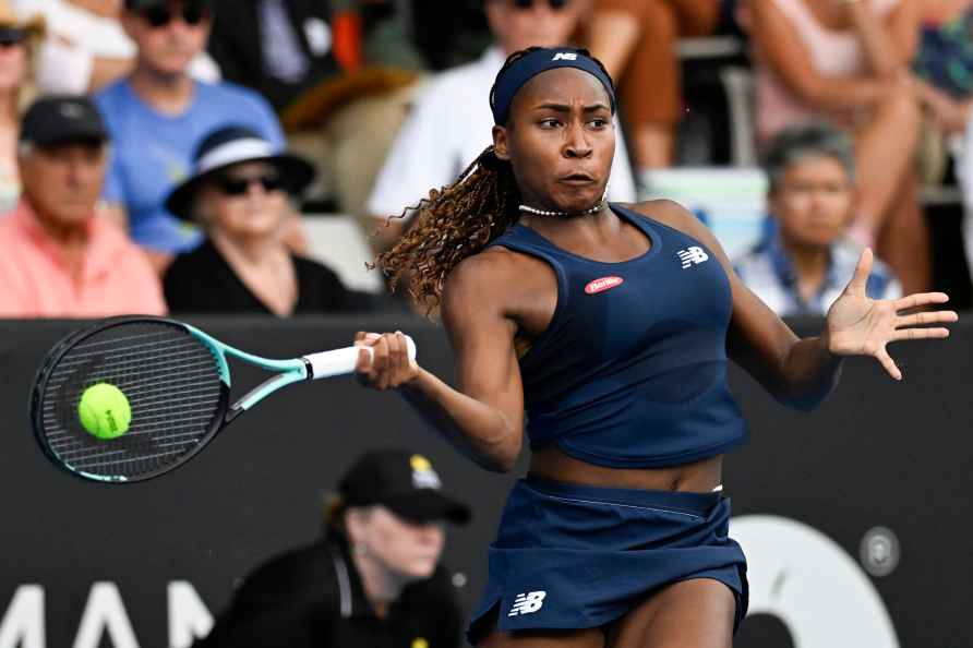 Coco Gauff of the United States plays a forehand return to compatriot...