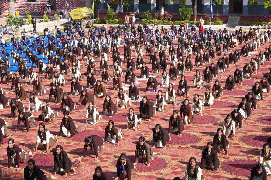 Jabalpur: School students perform 'Surya Namaskar' during a programme...