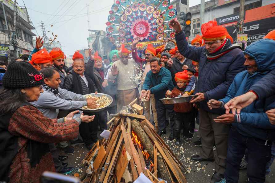 Jammu: People during the celebration of the Lohri festival, in Jammu...