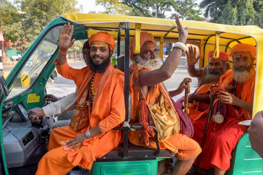 Nagpur: Sadhus ride an autorickshaw in Nagpur, Monday, Jan. 15, ...