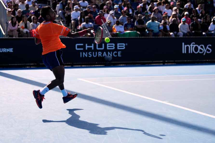 Sumit Nagal of India plays a forehand return to Shang Juncheng of...