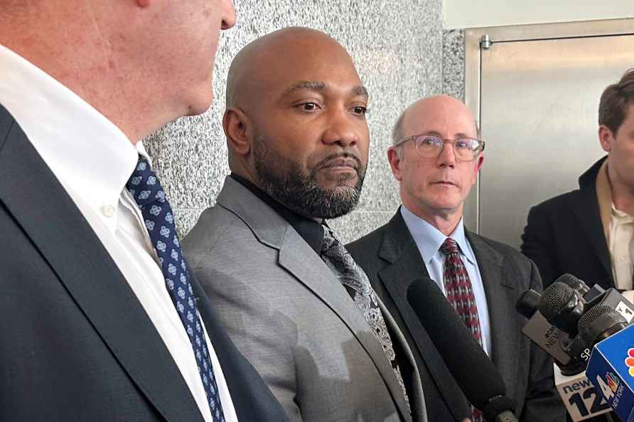 Steven Ruffin, center, who served 14 years in prison for a deadly...