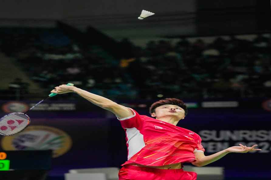 New Delhi: China's Shi Yuqi returns a shot during the men's singles...