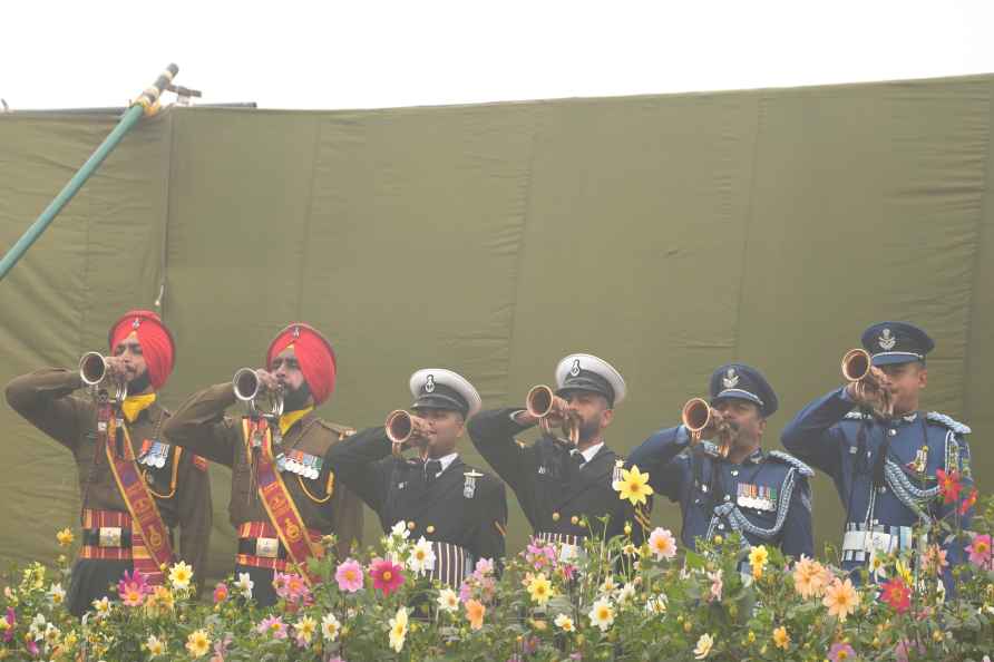 Indian soldiers play the bugle as they pay their respects to Mahatma...