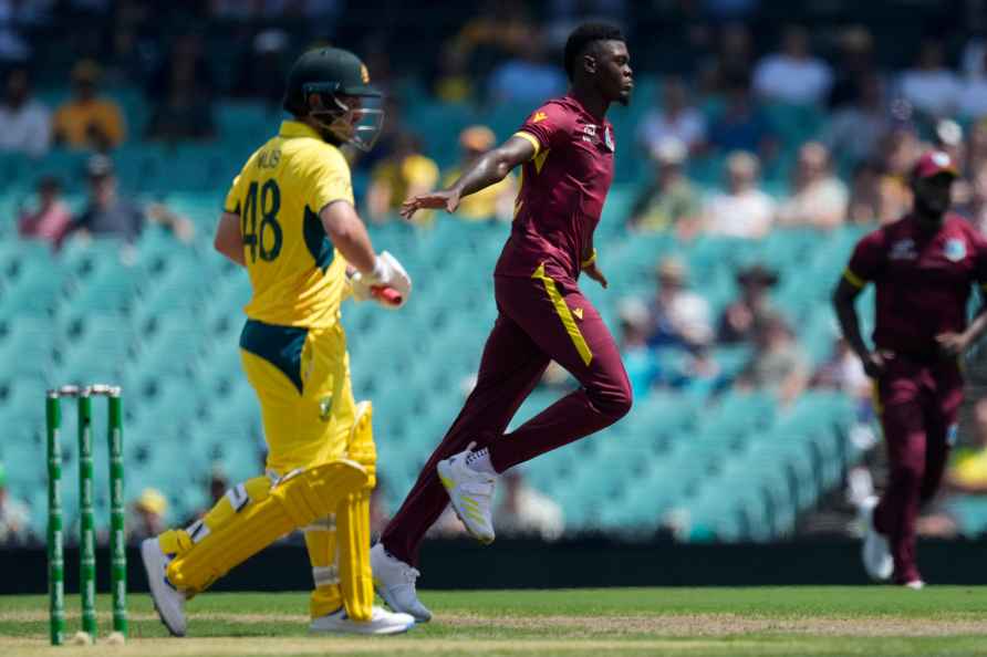 West Indies' Alzarri Joseph, center, celebrates taking the wicket...