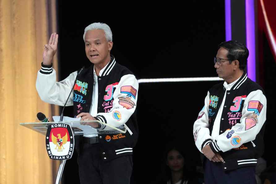 Presidential candidate Ganjar Pranowo, left, delivers his closing...