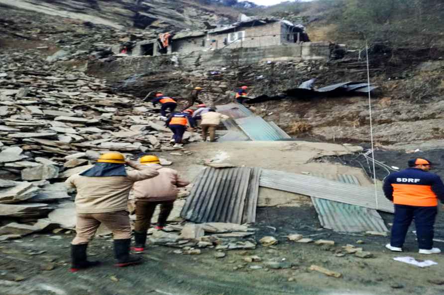 Shimla: Police and SDRF personnel at rescue work after massive landslide...