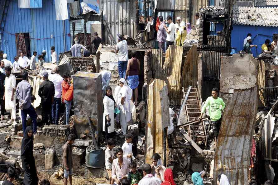 Mumbai: Residents at Baigan Wadi Govandi where a fire gutted many...