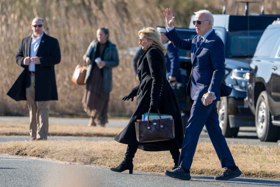 First lady Jill Biden and President Joe Biden walk to board Marine...