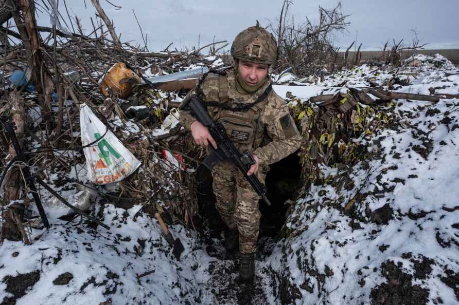 A Ukrainian soldier takes his position