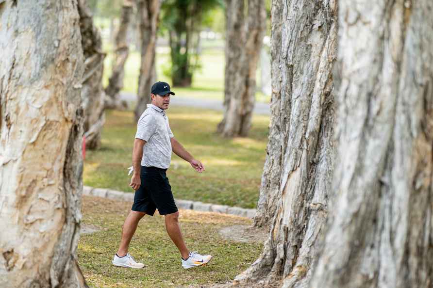 Captain Brooks Koepka of Smash GC walks between trees during the...