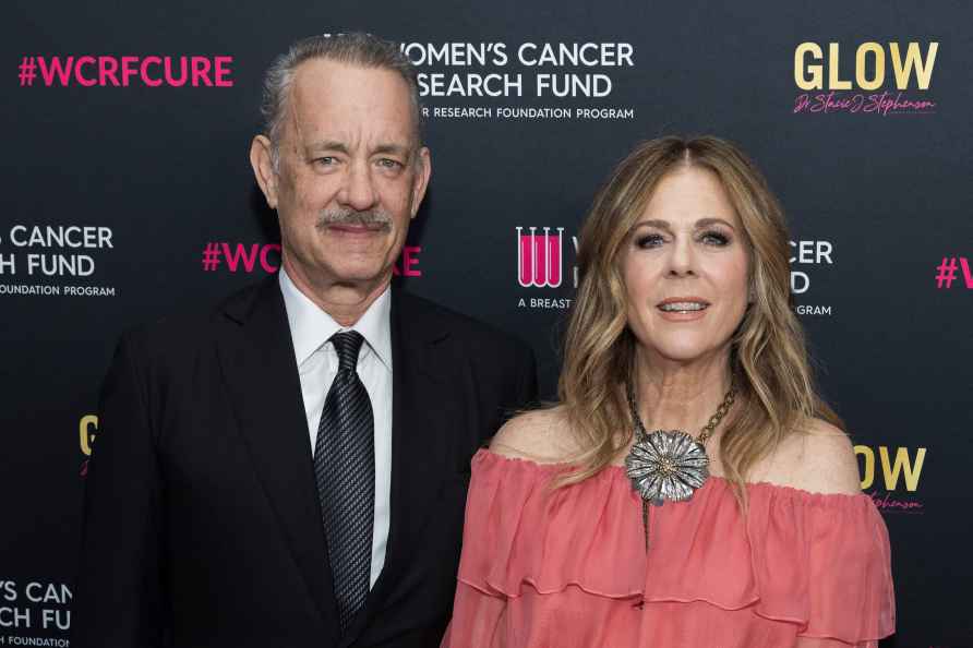 Tom Hanks, left, and Rita Wilson arrive at An Unforgettable Evening...