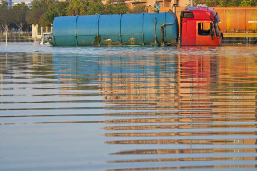 A tanker truck sits abandoned in floodwater in Dubai, United Arab...