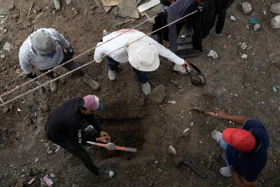 Relatives search for missing loved ones in clandestine grave