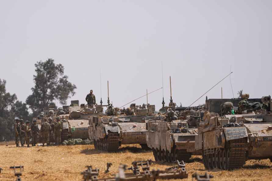 Israeli soldiers are seen at a staging ground