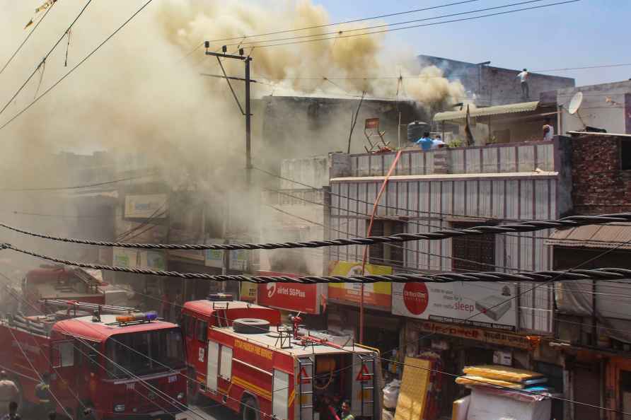 Meerut: Firefighters douse a fire which broke out in a showroom ...