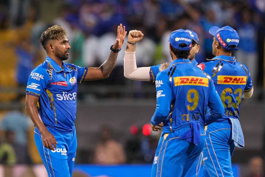 Mumbai: Mumbai Indians player Nuwan Thushara with teammates celebrates...