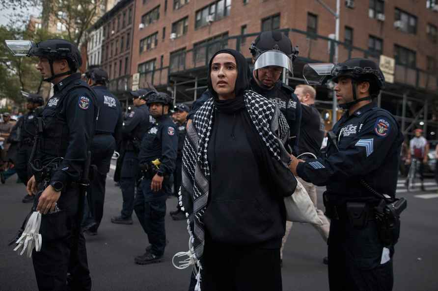 Police arrest a Palestinian protester