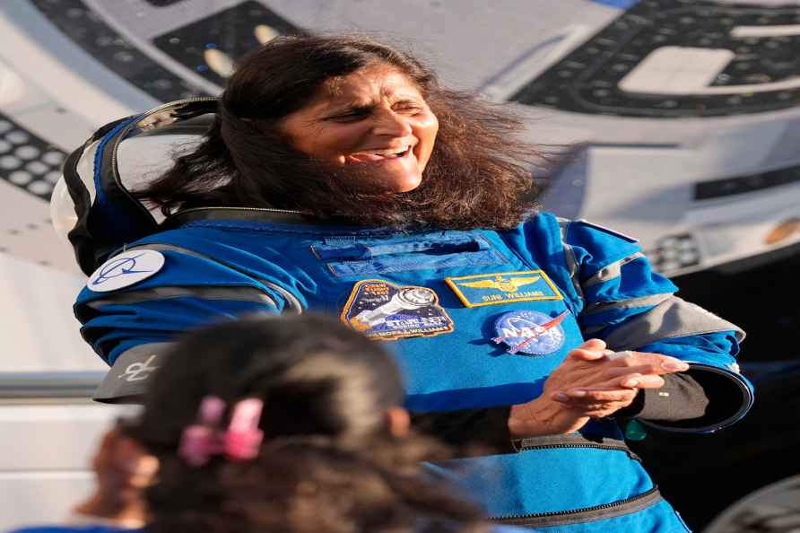 NASA astronaut Sunita Williams laughs with relatives as she leaves...