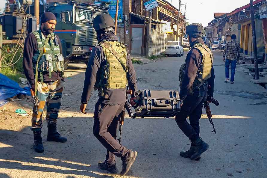 Kulgam: Security personnel stand guard after an encounter at Redwani...