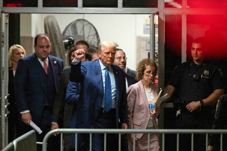 Former President Donald Trump, followed by his lawyer Susan Necheles...