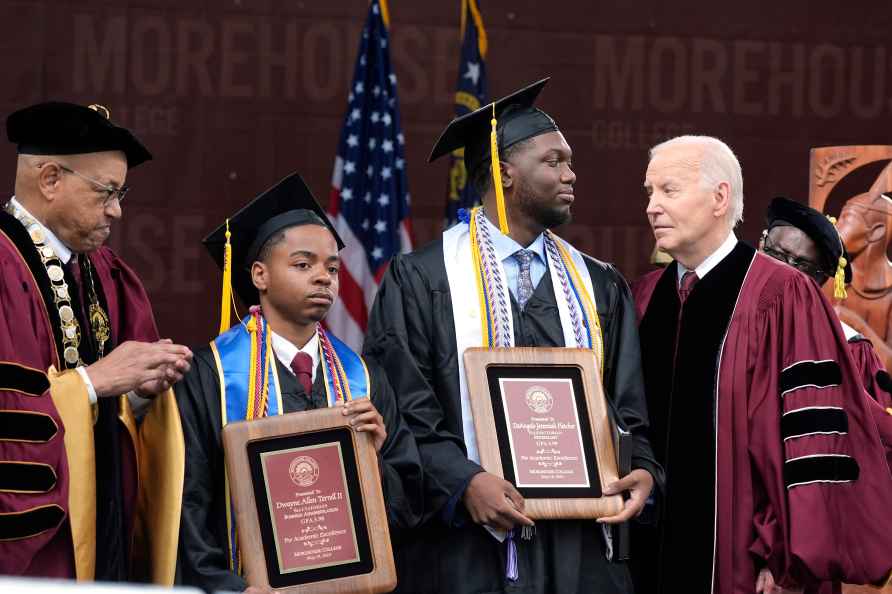 President Joe Biden, from right, addresses valedictorian DeAngelo...