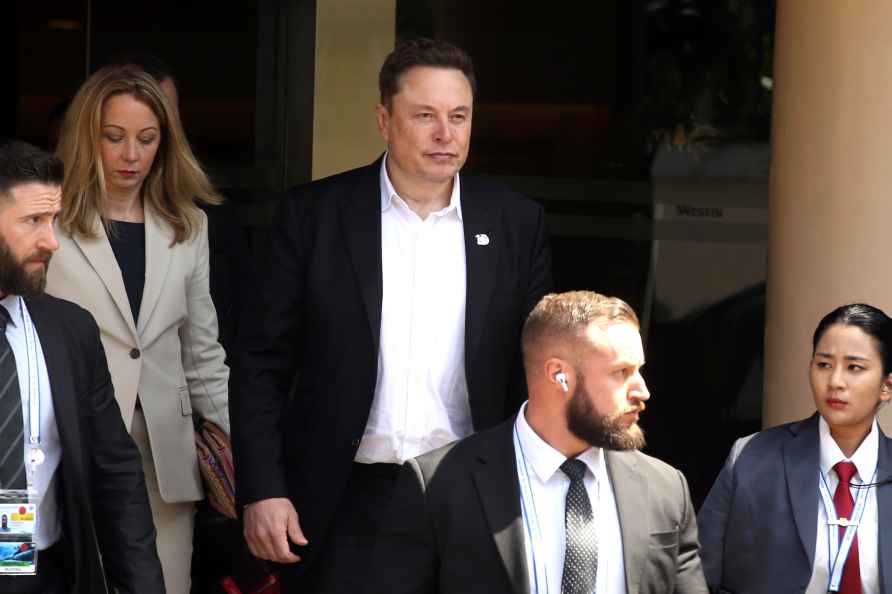 Elon Musk, center, arrives for the 10th World Water Forum in Nusa...