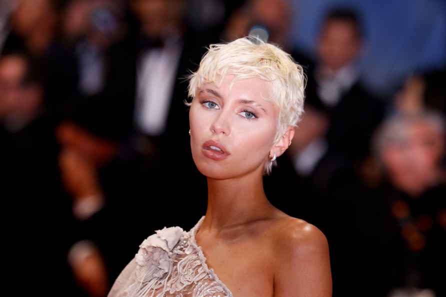 Iris Law poses for photographers upon arrival at the premiere of...