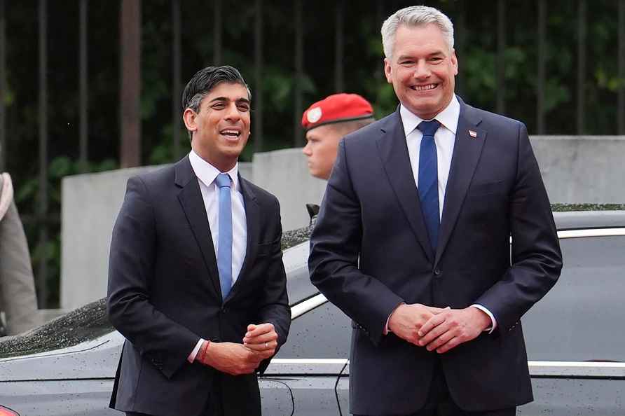 Britain PM Rishi Sunak and Austrian Chancellor Karl Nehammer share a light moment