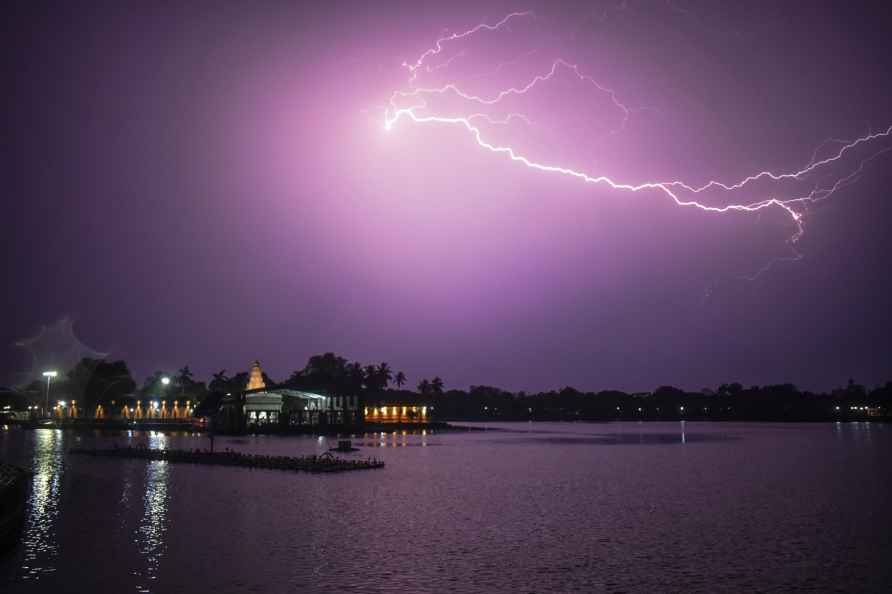 Solapur: Lightning flashes in the sky above Siddheshwar lake, in...