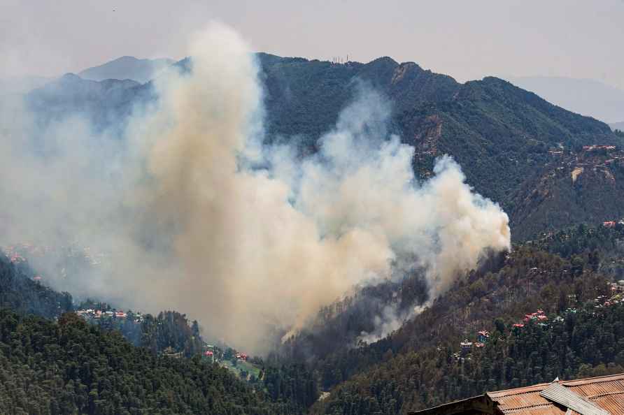 Shimla: Smoke billows from a forest fire, in Shimla, Tuesday, May...